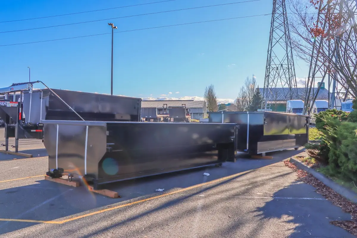Roll-off dumpster ready for waste disposal at job site for 2 Yard Dumpster Rental in Fruitland